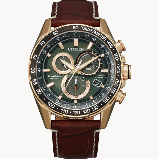 The Citizen Watch - PCAT - CB5919-00X by Citizen features Eco-Drive atomic timekeeping, a brown leather strap, rose gold case, green dial, multiple subdials, and a date window at 4 o’clock.