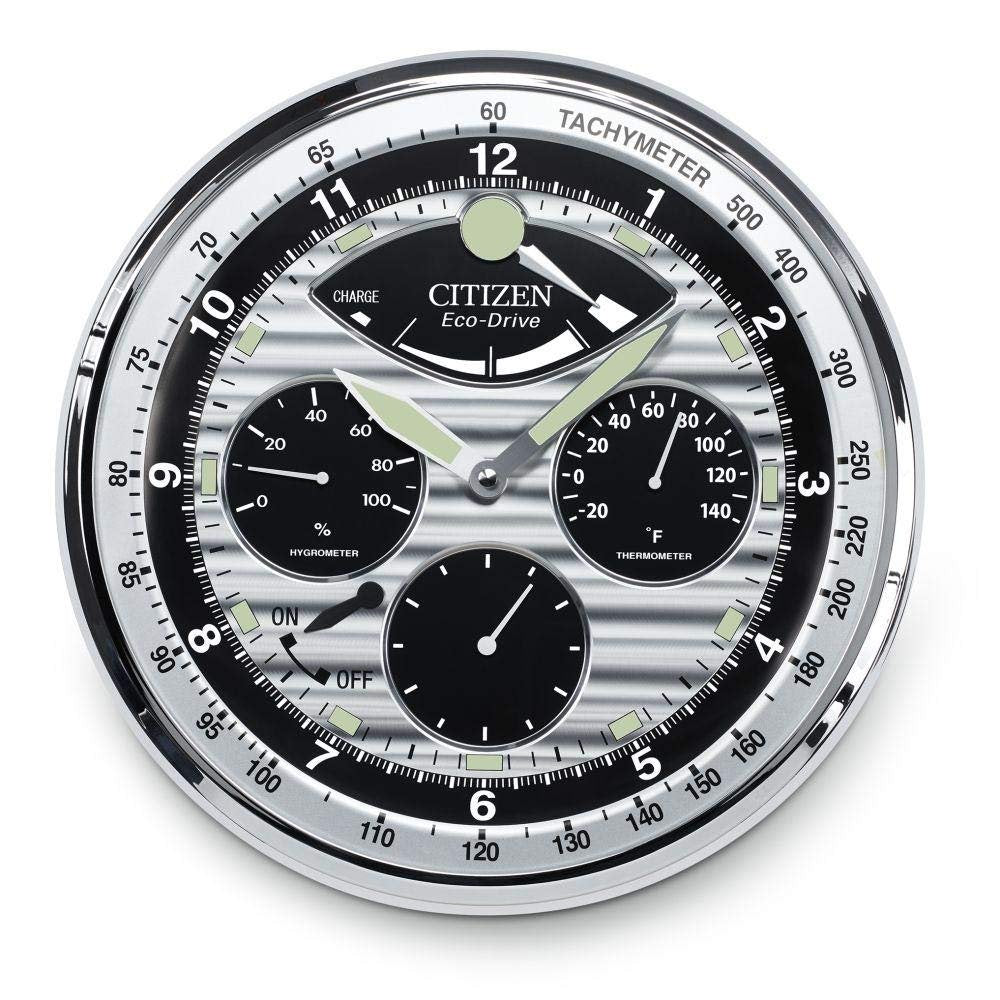 The CITIZEN Clock - Silver Glow in the Dark Clock - CC2013 by Citizen features a luminous white face with silver and black details, displaying time, power reserve, hygrometer, thermometer, and more in a sophisticated design.