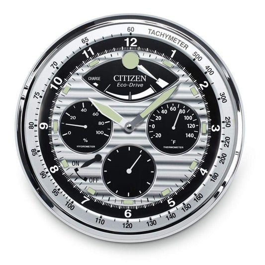The CITIZEN Clock - Silver Glow in the Dark Clock - CC2013 by Citizen features a luminous white face with silver and black details, displaying time, power reserve, hygrometer, thermometer, and more in a sophisticated design.