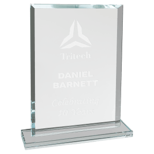The JDS 7 3/4" Rectangle Clear Glass Award (CGS32) showcases beveled edges, an etched logo, and custom text on clear glass. It stands upright on a rectangular base for an elegant display.
