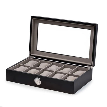 The Bey-berk CM639BLK is a black watch box with a glass top, gray interior, and 10 cushioned compartments. It features a built-in quartz clock on the front for style and convenience.