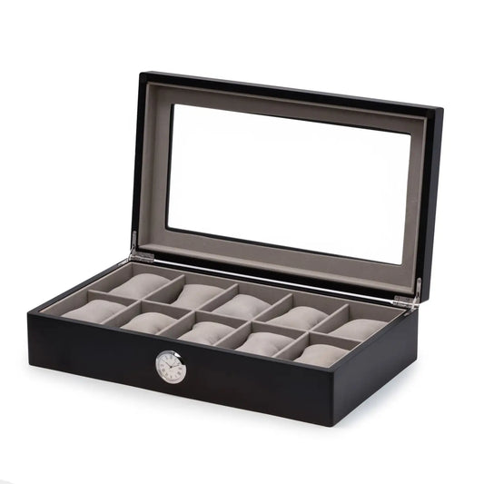 The Bey-berk CM639BLK is a black watch box with a glass top, gray interior, and 10 cushioned compartments. It features a built-in quartz clock on the front for style and convenience.