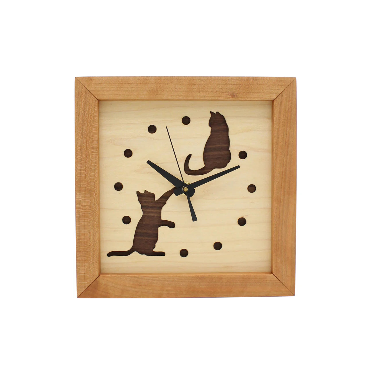 The Sabbath Day Woods Cats At Play Box Clock is a square wooden wall clock with a light face, dark hour dots, black hands, and two cutout cat silhouettes—one sitting top right, one reaching up bottom left. A charming gift for cat lovers.