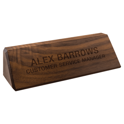 The JDS Walnut Desk Wedge 8" (DS8) is crafted from genuine walnut with a smooth, dark finish and elegantly angled. Engraved in all caps with "ALEX BARROWS CUSTOMER SERVICE MANAGER." Brand: JDS.