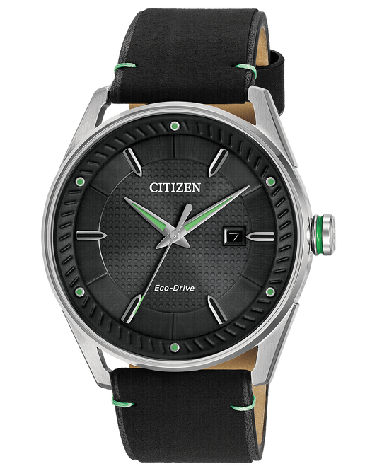 The Citizen Watch - Drive BM6980-08E features a black textured dial, silver markers and hands, date at 3 o’clock, and a black leather strap with green stitching—perfect for men seeking style and functionality.