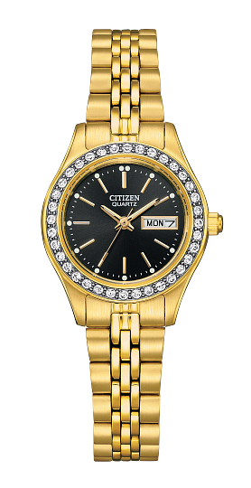 The Citizen Watch - Ladies Quartz EQ0532-55E features a gold-tone design, black dial, diamond-like bezel accents, stainless steel bracelet band, and a day-date display at 3 o’clock.