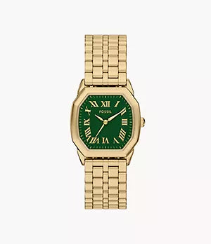 The Fossil Harlow ES5451 is a gold-tone stainless steel watch with a green rectangular dial, Roman numerals, metal link band, and the Fossil brand name displayed on the face.
