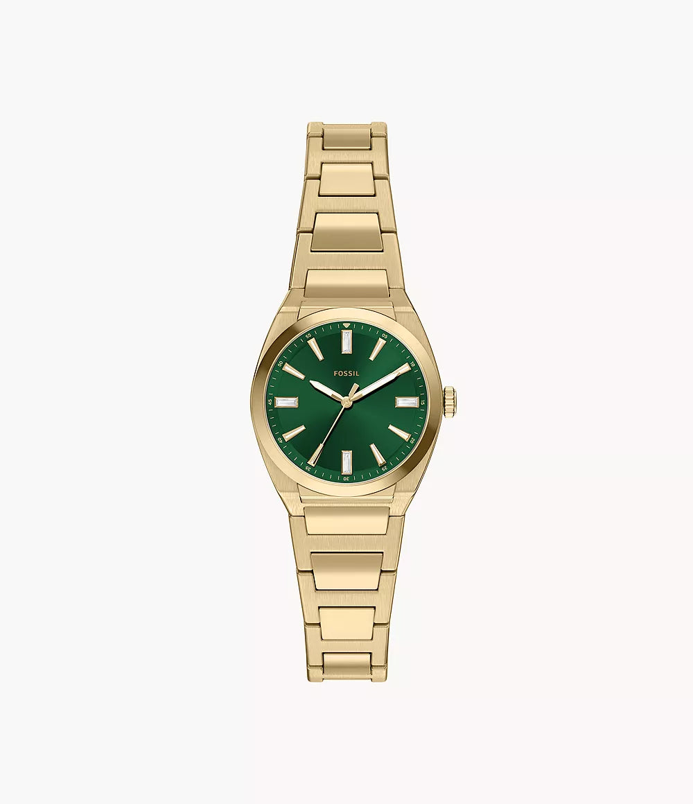 Displayed against a plain white background, the Fossil Ladies’ Everett Watch (ES5493) features a gold metal linked bracelet band and gold hour markers accenting its striking green sunray dial. This sophisticated timepiece by Fossil perfectly blends classic elegance with contemporary style.