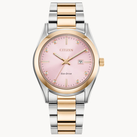 The Citizen Watch - Sport Luxury - EW2706-58X features a stainless steel silver and gold band, pink dial, gold hour markers with crystals, date window at 3 o'clock, and elegant gold detailing on the bezel, crown, and hands.