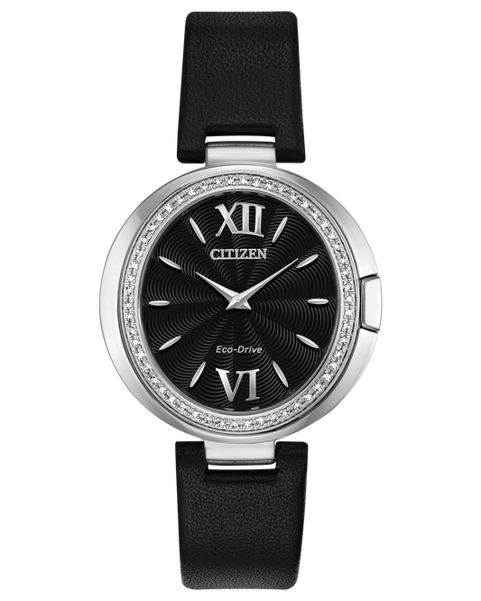 The Citizen Watch Capella EX1500-01E features Eco-Drive technology, a black leather strap, black textured dial, silver hands, Roman numerals at 12 and 6, and a crystal-adorned silver bezel.