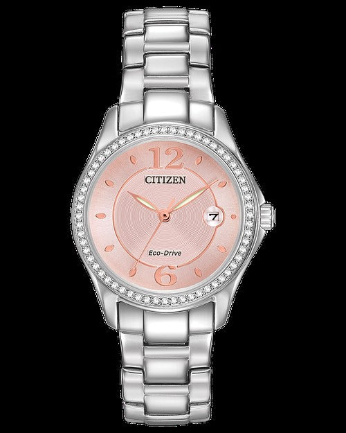 The Citizen Silhouette Crystal FE1140-86X women's watch features a silver strap, pink dial, diamond-accented bezel, and a date display at 3 o’clock.