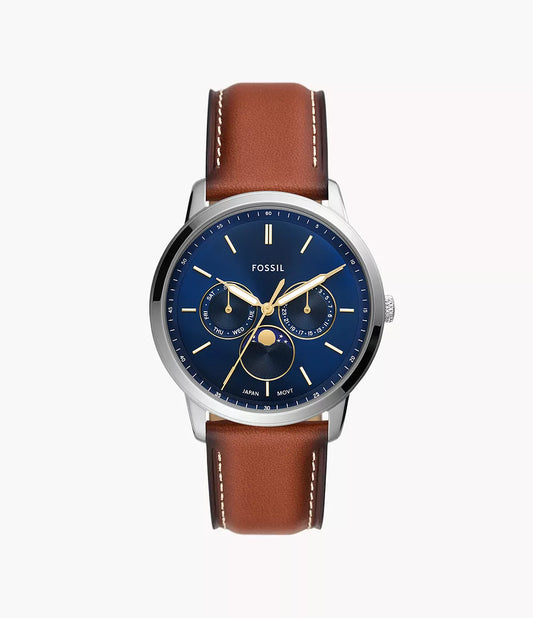 The Fossil Watch - Neutra Moonphase - FS5903 by Fossil features a brown leather strap, silver case, blue dial with gold hands and subdials, moon phase indicator, plus month and date functions.