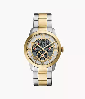 A Fossil Townsman Big Tic wristwatch (FS6193) featuring a two-tone silver and gold metallic band and a skeleton dial that reveals tourbillon-style gears and the watch’s intricate inner workings.