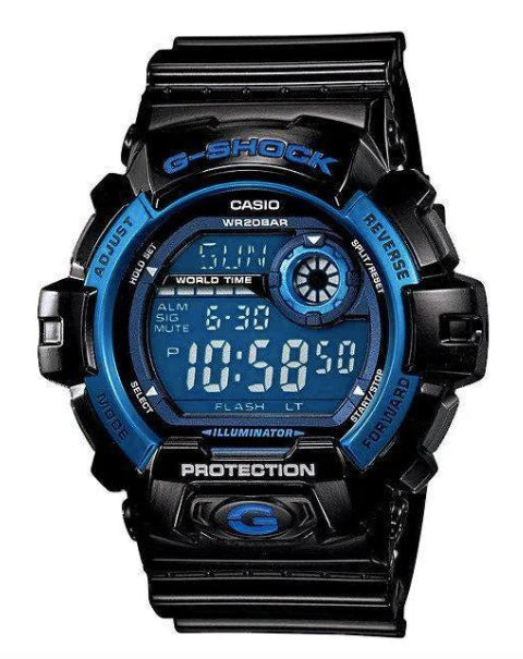 The Casio G-Shock Watch - G8900A-1 by VLC Distribution Co. is a black and blue watch displaying 10:58:50, with world time, alarm, illumination, shock resistance, 200m water resistance, and labeled face buttons.