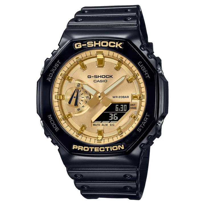 Casio G-Shock Watch - GA2100GB-1ACR analog-digital watch with a black resin strap, black octagonal bezel, and a metallic gold face with luminous hands and a digital display window.