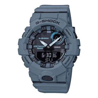 The VLC Distribution Co. G-Shock Watch - Health and Fitness (GBA800UC-2A) features a rugged gray design, round digital/analog display, and multiple bezel buttons—ideal for active lifestyles. Digital time displays 6:30:36.