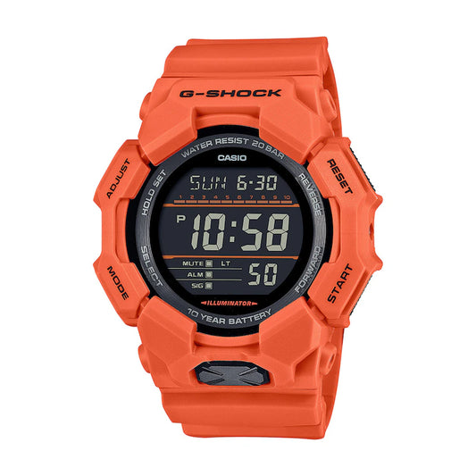 The Casio G-Shock Watch - World Time - GD010-4 by VLC Distribution Co. features a bright orange bio-based resin case, displays the time 10:58 and date Sunday 6-30 on its round face with black details and labeled bezel buttons.