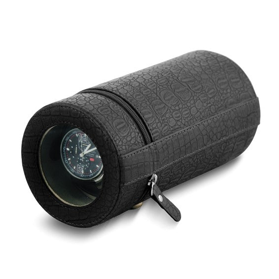 The Quality Gold Watch Winder - Black Faux Crocodile (GM8463) by Quality Gold is a cylindrical, zippered case with a round transparent window, showcasing your watch inside. Ideal as a protective accessory for your timepiece.
