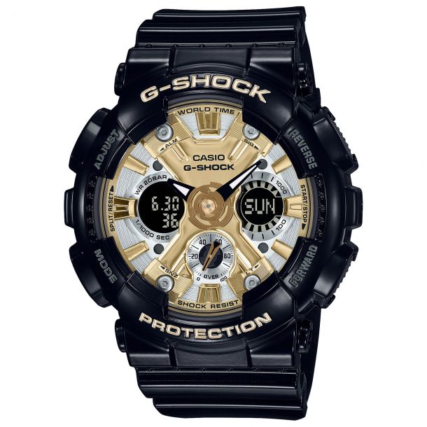 The VLC Distribution Co. G-Shock Watch - Compact Design (GMAS120GB-1A) features a black case, gold and silver accents, analog-digital displays, multiple dials, labeled edge buttons, and shock resistance for stylish durability.