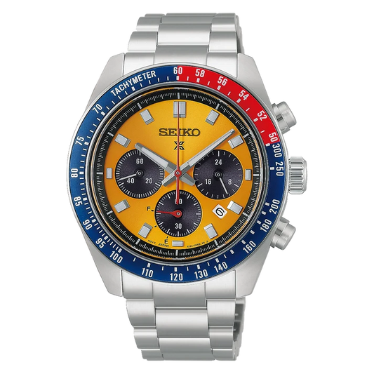 The Seiko Watch - Prospex Speedtimer Pogue Solar - HBJ004 is a stainless steel chronograph featuring a striking yellow dial, blue and red bezel, three black subdials, and silver hour markers. Powered by the reliable V192 movement, it includes a tachymeter scale and push buttons on the right side. This Seiko timepiece blends iconic Pogue-inspired design elements with cutting-edge solar technology.