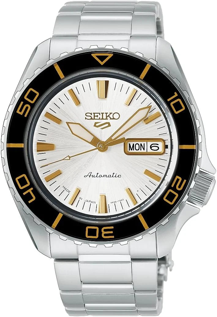 Seiko Watch - Seiko 5 - HDB004 automatic watch with a silver stainless steel link band, a white dial with gold indices and hands, and a black rotating bezel with gold numeral markings.