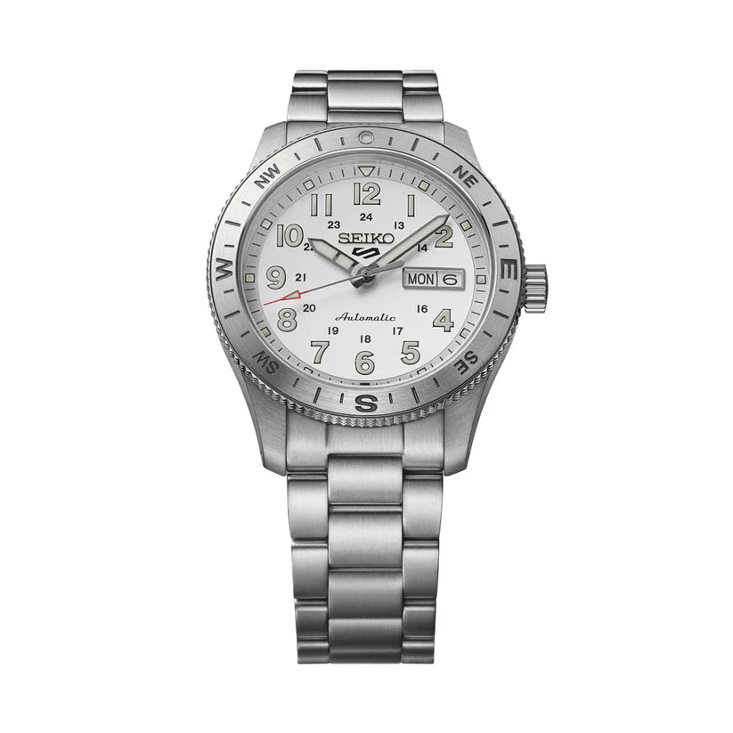 The Seiko Watch - Seiko 5 Automatic - HDB007 features a silver metal band, white dial with large numerals, day/date display, compass bezel markings, raised hands and hour markers. Reliable automatic movement for daily wear.