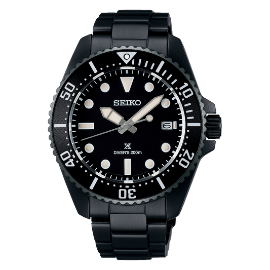 The Seiko Watch - Diver - SNE599 features a black stainless steel band, round black dial with white markers, solar movement, date at 3 o’clock, and “DIVER’S 200m” above 6 o’clock. Brand: Seiko.