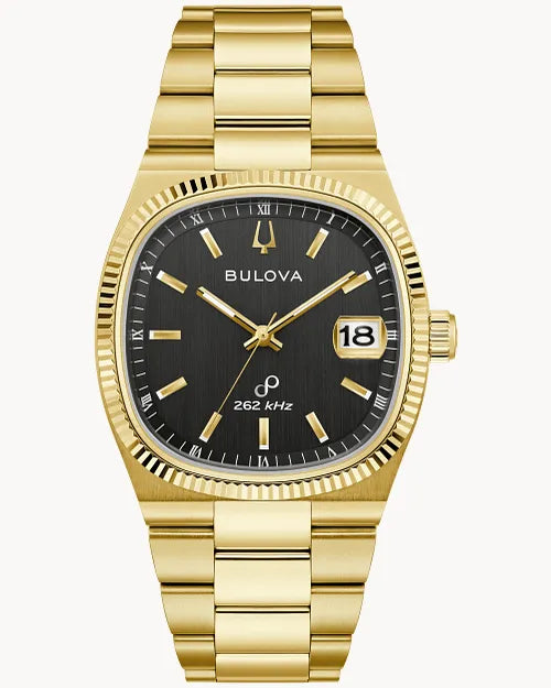 The Bulova Super Seville 97B246 is a gold-tone stainless steel wristwatch with black dial, gold hour markers, date at 18, fluted bezel, link bracelet, and “262 kHz” above 6 o’clock—highlighting its Precisionist movement.