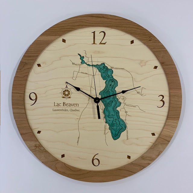 The Lac Beaven - Laurentides Quebec - Lake Wall Clock by Lake Art is a round clock with a wooden face, blue lake map, surrounding land details, and a wood rim featuring numbers at 12, 3, 6, and 9.