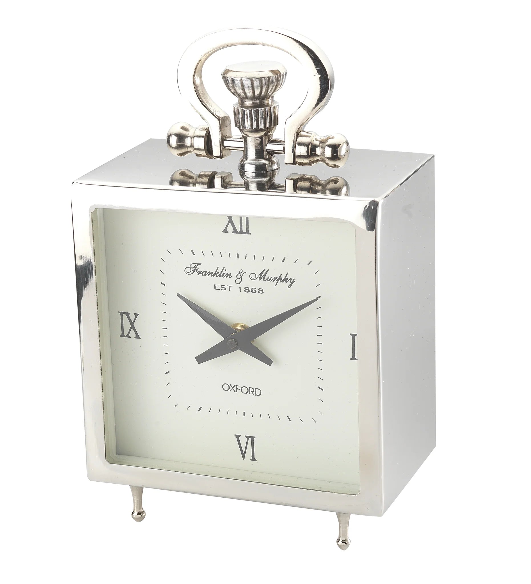 The A Sanoma Steel/Aluminum Small Tabletop Clock (KG502) features a silver rectangular design, white face, black Roman numerals and hands, a decorative handle, small legs, and Franklin & Murphy EST 1868 OXFORD labeling.