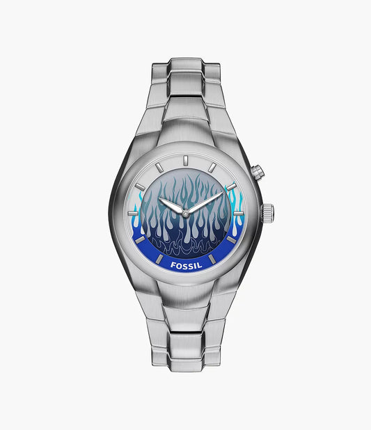 The Fossil Watch - Limited Edition Y2K Big Tic (LE1234) features a silver metal band, round face with blue and black flame dial, striking blue bezel accent, and the Fossil logo at the bottom.