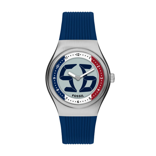 The Fossil Watch - Limited Edition Big Tic - LE1237 features a blue ribbed strap, round silver case, bold blue and red "SG" logo on the dial, black hour markers, and "FOSSIL" at the bottom center.