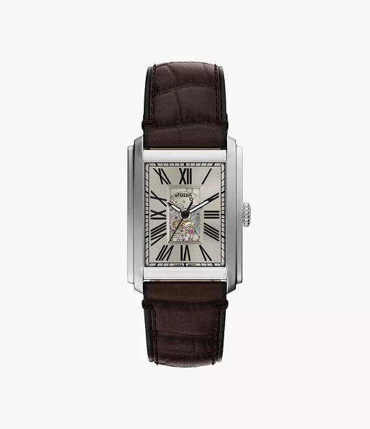 The Fossil Watch - Carraway - ME3272 by Fossil features a rectangular silver case, brown leather strap, Roman numeral markers, and a partially open dial showcasing the automatic movement. Shot against a plain white background.