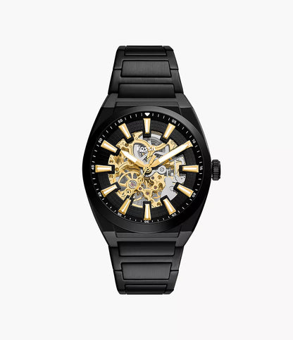 Fossil Watch - Everett - ME3289, a black automatic watch featuring an openwork dial, gold-tone indices, and a black link bracelet.
