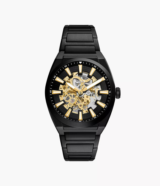 Fossil Watch - Everett - ME3289, a black automatic watch featuring an openwork dial, gold-tone indices, and a black link bracelet.