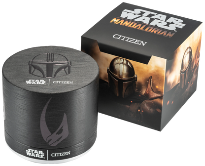 The Citizen Watch - Mandalorian - CA0857-09W comes in a round black watch box and square outer box, both with Star Wars: The Mandalorian designs—Mandalorian helmet, Mudhorn symbol, and Star Wars Citizen logos.