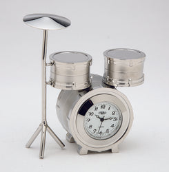 The Sanis Enterprises Sanis Mini Clock - Drum Set Silver (N47SIL) is a silver mini clock shaped like a drum set, with two drums and a cymbal. The clock face sits where the bass drum would be—an ideal gift for music lovers.