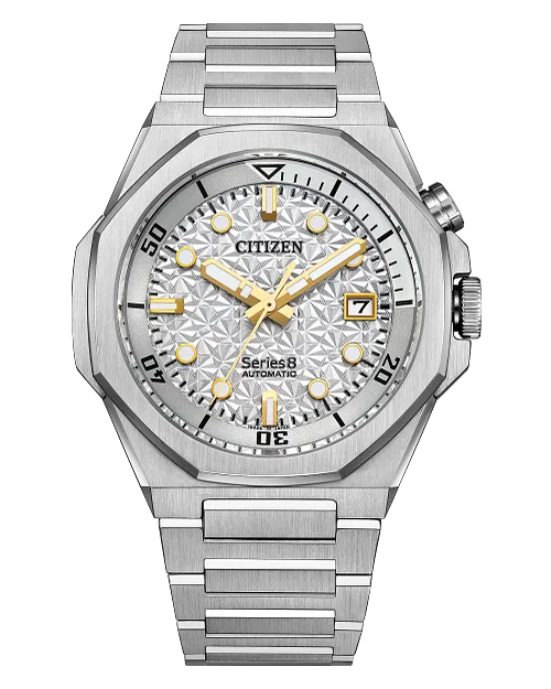 The Citizen Watch - Series8 890 City Lights (NB6060-58H) features a stainless steel case, silver geometric-patterned dial, gold markers and hands, sapphire crystal, date at 3 o’clock, and a brushed metal bracelet.