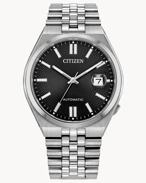 The Citizen Watch - TSUYOSA 60 Automatic (NK0020-55E) features a black textured dial, white hour markers, silver hands, a date window at 3 o'clock, and a stainless steel bracelet.