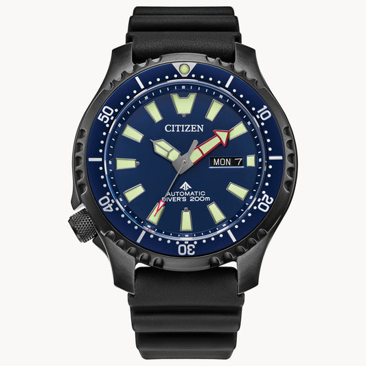 The Citizen Promaster Dive Automatic NY0158-09L men’s watch features a black case and strap, blue dial with luminous markers and hands, red arrow seconds hand, day-date display (MON 7), dive bezel, and “DIVERS 200m” on the dial.