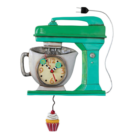 The Enesco Allen Designs Clock - Vintage Mixer (P1370) is a retro green stand mixer clock with the clock face in the bowl and a cupcake pendulum, plus a trailing power cord for added charm.