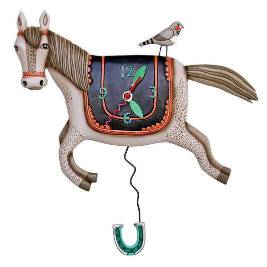 The Enesco Allen Designs Whoa Horsey Clock (P1602) features a whimsical horse shape with a bird perched on its back, a saddle clock face, and a dangling horseshoe pendulum. This charming clock stands out against any white background.