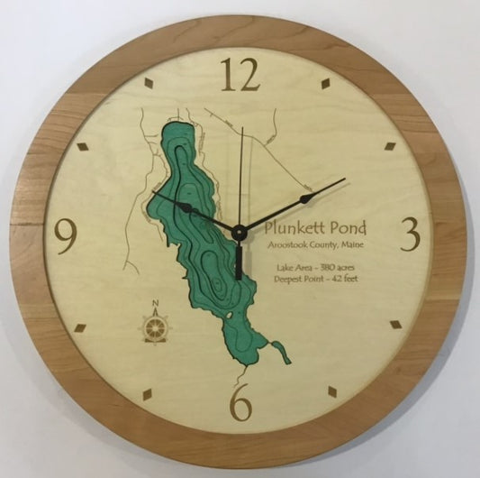The Lake Art Lake Clock - Plunkett Pond is a custom wooden clock featuring a map of Plunkett Pond in Aroostook County, Maine, with depth contours, compass rose, 380-acre area, and 42-foot depth—ideal lake decor for any space.