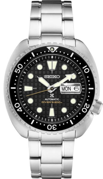 The Seiko Watch SRPE03 Prospex Automatic Diver features a silver stainless steel bracelet, black textured dial with bold white markers, day-date display, minute-marked bezel, and is water-resistant to 200 meters.