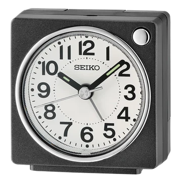 The Seiko Clock - Bedside Alarm - QHE196KLH is a square black quartz clock with a white face, black numerals, and two hands at 2:09. A silver button on the top right makes it perfect for your bedside.