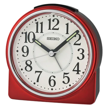 The Seiko Clock - Bedside Alarm - QHE198RLH features bold black numbers, two glow-in-the-dark hands showing 10:10, and comes in red, set against a white background.