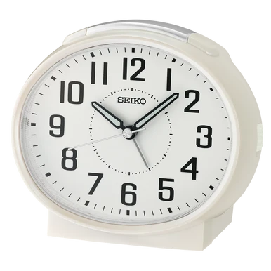 The Seiko Clocks - Bedside Alarm - QHK059WLH is a white Seiko alarm clock with black numerals and hands, displaying the time as 10:10:35. Featuring reliable quartz movement, a sleek curved rectangular design, and a crisp white face, this clock makes an excellent choice for your bedside.