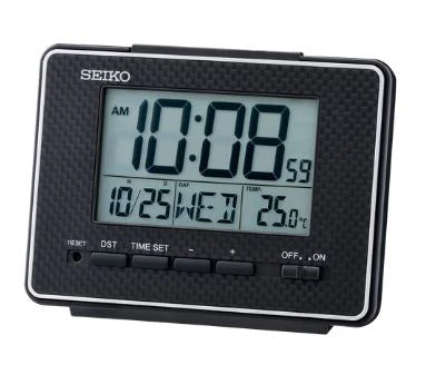 The Seiko Clock - Digital Alarm Clock - QHL096K displays 10:08 AM, October 25th (Wednesday), and 25.0°C. This black rectangular Seiko clock features calendar, thermometer, alarm, and snooze functions with several control buttons.