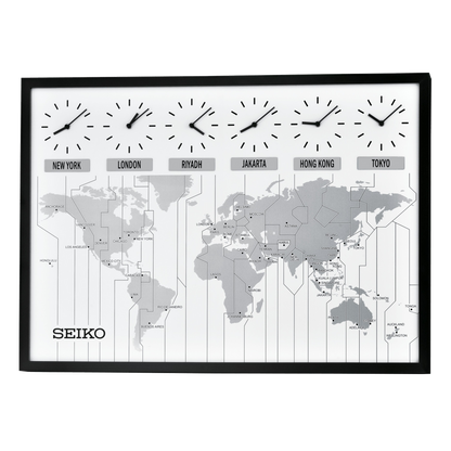 The Seiko Clock - World View Wall Clock (QXA538KLH) by Seiko features a large wooden frame with six clocks for New York, London, Riyadh, Jakarta, Hong Kong, and Tokyo above a gray global time zone map.
