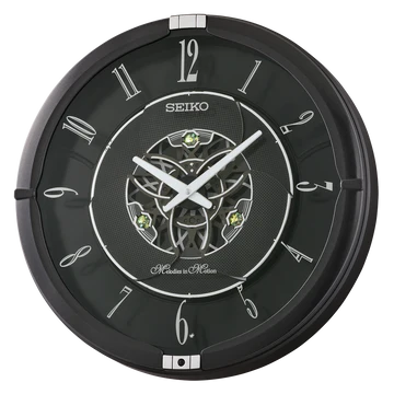 The Seiko Clocks Melodies in Motion QXM621K is a round black wall clock with silver hands, Roman numerals, an open center revealing inner gears, precise quartz movement, and displays 1:50.
